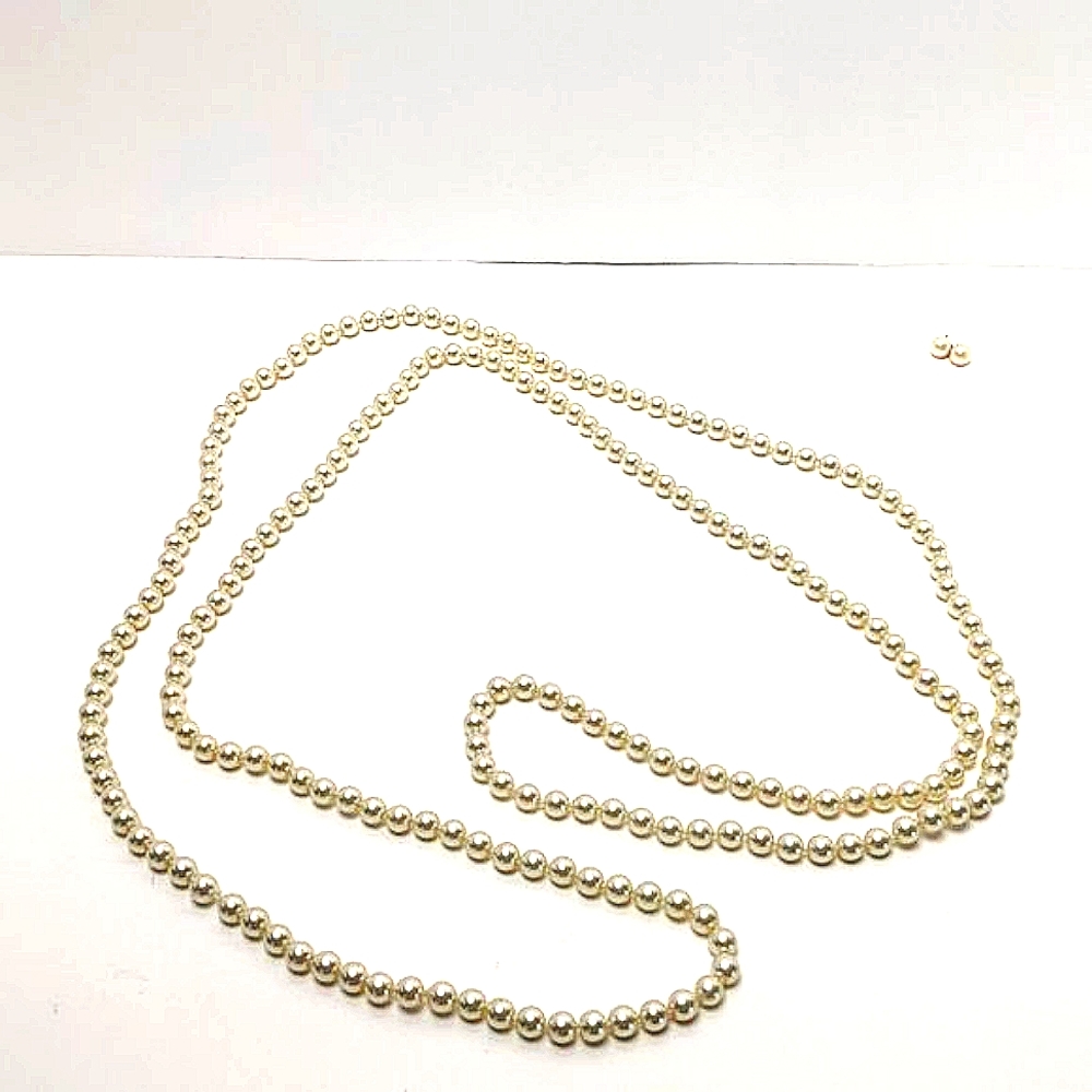 Extra long strand imitation pearls with matching earrings